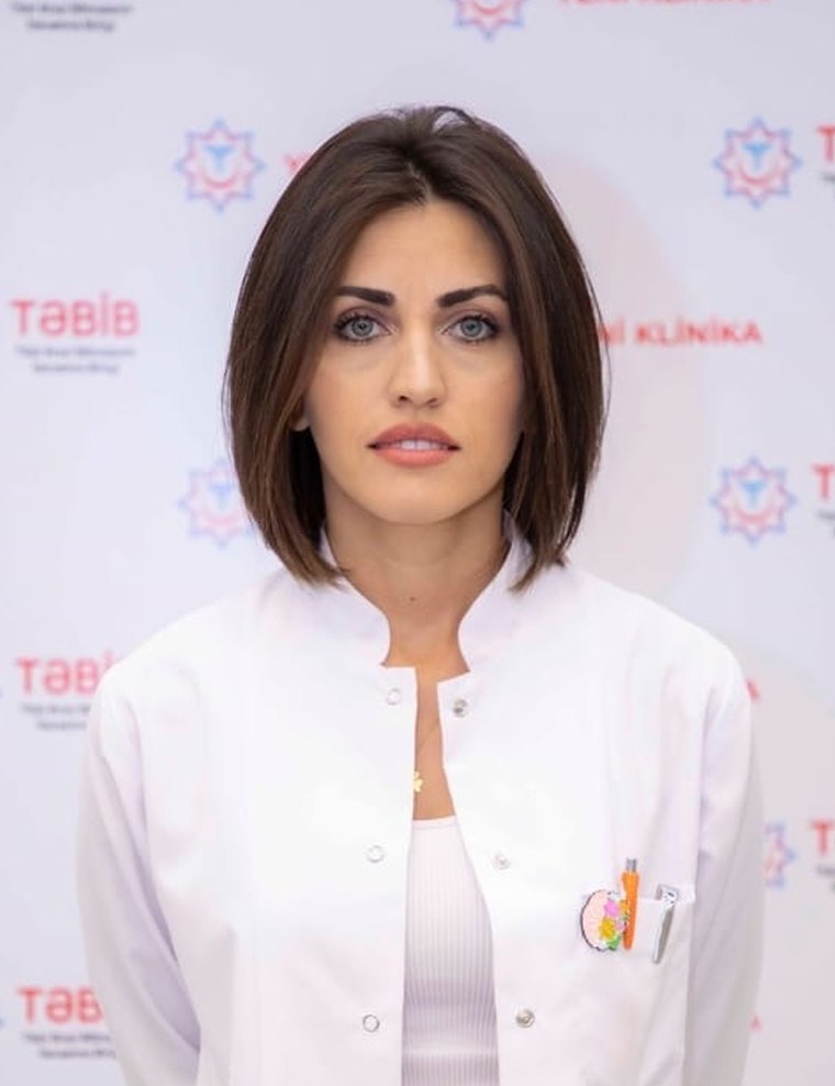 Dr. Minarə Çərkəzzadə, ağ həkim xalatında